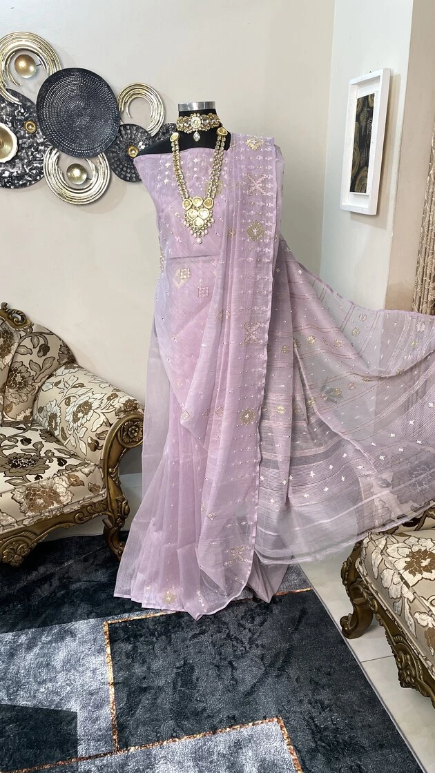 This is a Picture of a Dhakai Jamdani Saree. There are multiple designs woven in the Saree known as 'Motifs'.