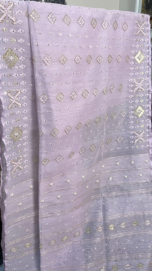 This is a Picture of a Dhakai Jamdani Saree. There are multiple designs woven in the Saree known as 'Motifs'.