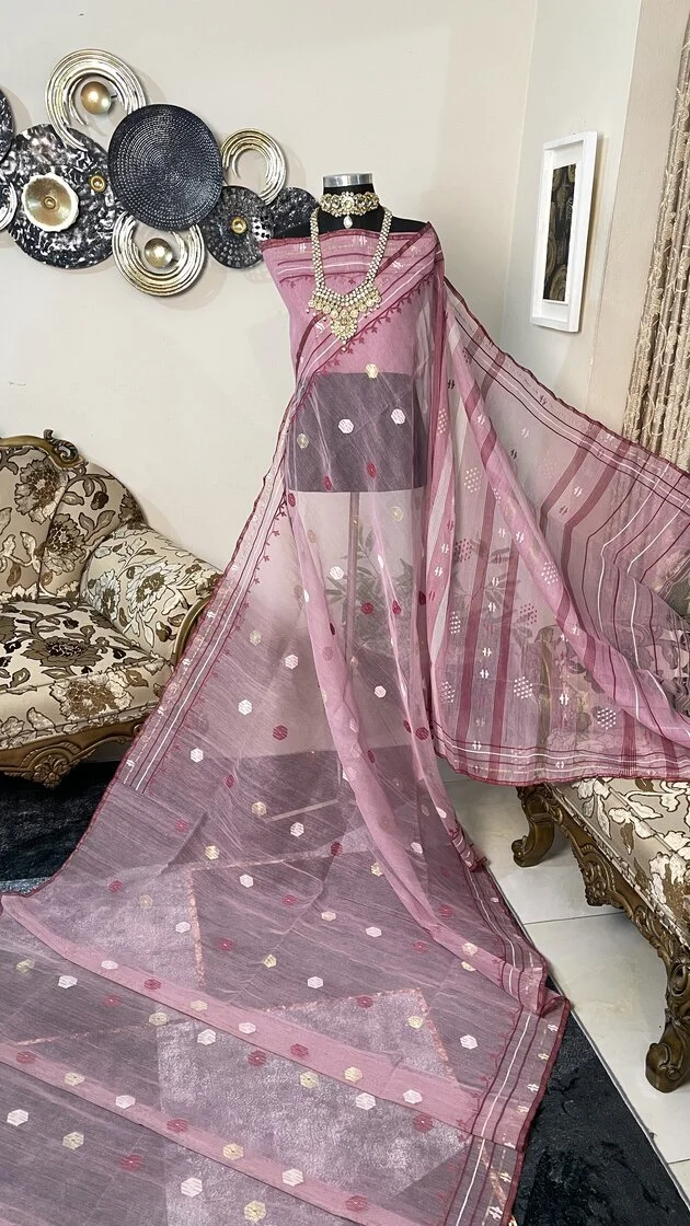 This is a Picture of a Dhakai Jamdani Saree. There are multiple designs woven in the Saree known as 'Motifs'.