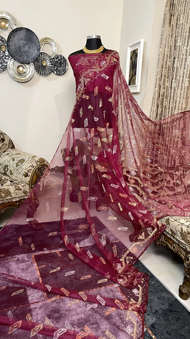 This is a Picture of a Dhakai Jamdani Saree. There are multiple designs woven in the Saree known as 'Motifs'.