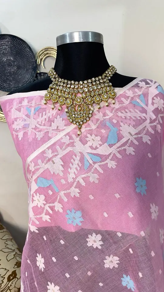 This is a Picture of a Dhakai Jamdani Saree. There are multiple designs woven in the Saree known as 'Motifs'.