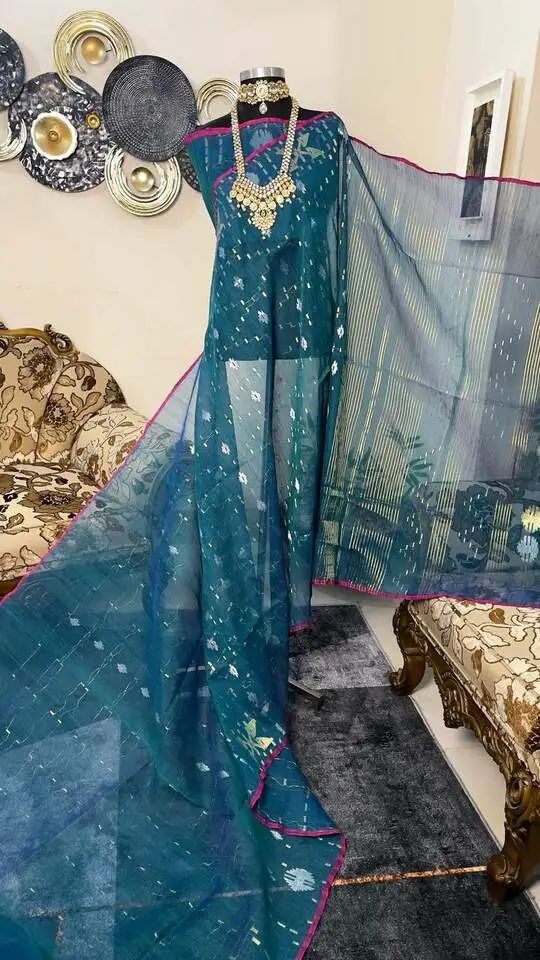 This is a Picture of a Dhakai Jamdani Saree. There are multiple designs woven in the Saree known as 'Motifs'.