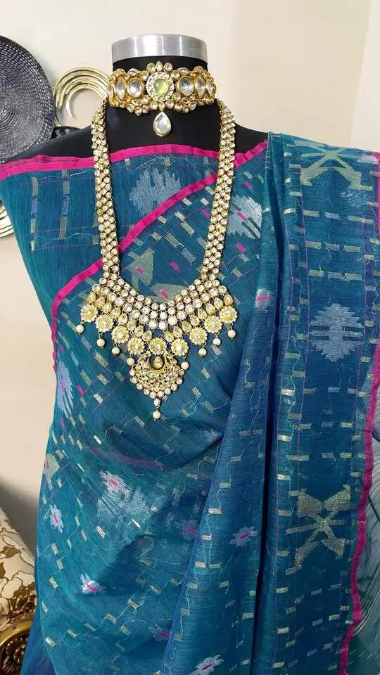 This is a Picture of a Dhakai Jamdani Saree. There are multiple designs woven in the Saree known as 'Motifs'.