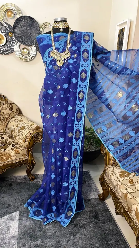 This is a Picture of a Dhakai Jamdani Saree. There are multiple designs woven in the Saree known as 'Motifs'.